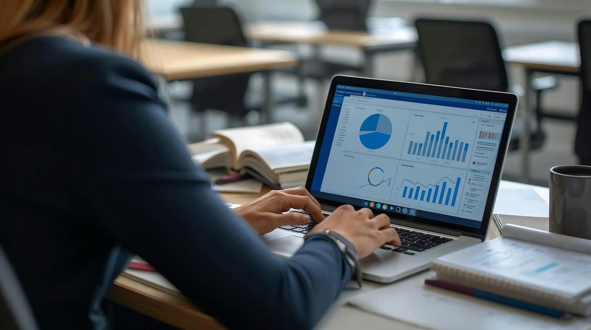 Data-analist werkt met grafieken en dashboards op een laptop